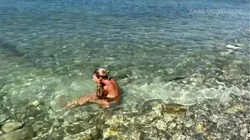 Slender tanned blonde gets fucked on the beach by the sound of waves during a photo shoot