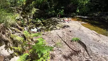 An impudent Voyeur Fingered a Naked Milf on a Nudist Beach in the Forest