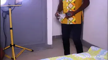 The photographer and his model caught in a photo session fucking copiously with his big and long cock in public on African porn movies