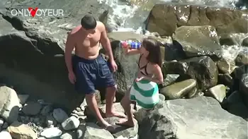 Beach Voyeur. Horny teen babe rides her boyfriend on the beach