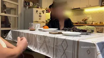 My husband jerking under a table front of my step mom and i right at the kitchen.