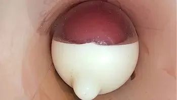 The camera in the deep pussy records a huge ejaculation of sperm into the condom