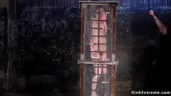 Babe in cage gets water bondage