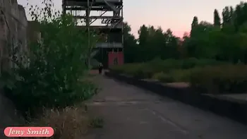 Jeny Smith is walking naked through an abandoned factory.
