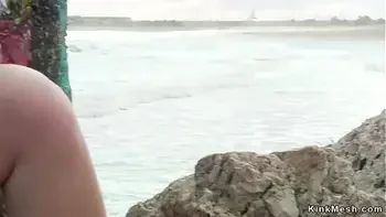 Domme pisses on chained blonde outdoor