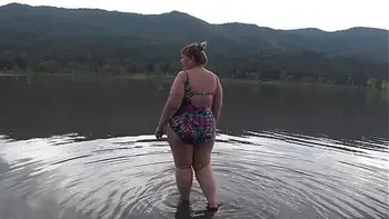 BBW with big booty in tight jeans is dressing in a public dressing room on the beach. Fetish.