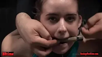 Gagged drooling brunette is dominated