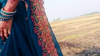 Desi Bhabhi RadhaDevi Pissing in Field Outdoor Hindi Webcam Masturbation