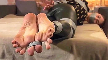 Beautiful girl tape bondage leather leggings