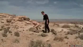 Busty blondes hogied in a desert
