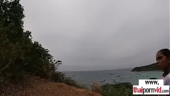 Amateur Thai teen Cherry fucked by a big white cock from behind outdoor