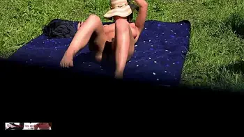 My neighbors' is tanning naked in the garden