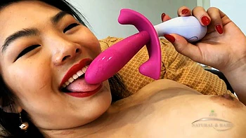 Watch Nari Park play with her hairy Asian pussy while adding a toy to the mix: Porn
