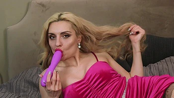 Blonde Caty Kiss caresses her body in sexy lingerie and stockings