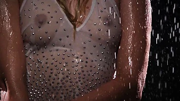 Sexy blonde MILF flaunts wet nude figure