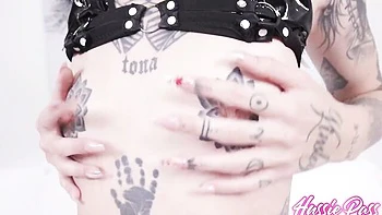 Inked hottie CC Doll is enjoying hardcore black and white penetration