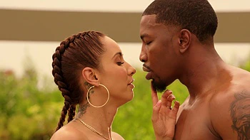 Isis Love enjoys ball sucking and riding a big black cock