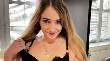 Bra-free Dee Dee fingers her shaved pussy