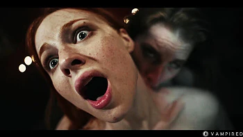 Redhead Vampire Surrenders Pussy to Sonya in Lesbian Fight