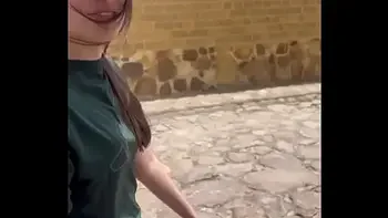 Two lesbians touch each other to orgasm on the corner of a town trying to avoid being seen by anyone