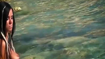 Ashley Bulgari's Big-Tit Milf Strips on Beach